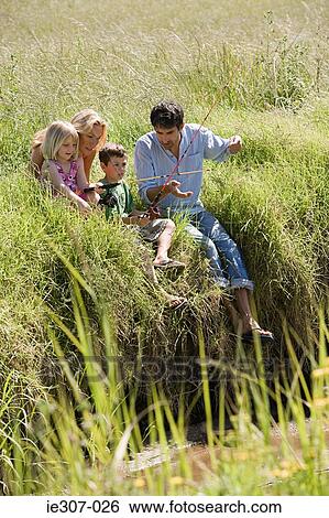 Stock Photograph - A family fishing. Fotosearch