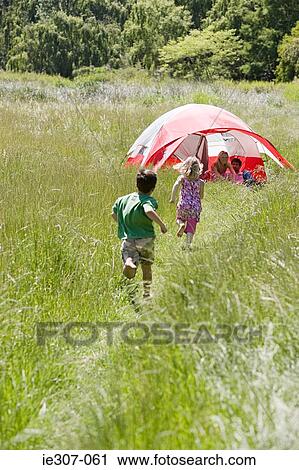 Stock Image - Children running to their parents. Fotosearch