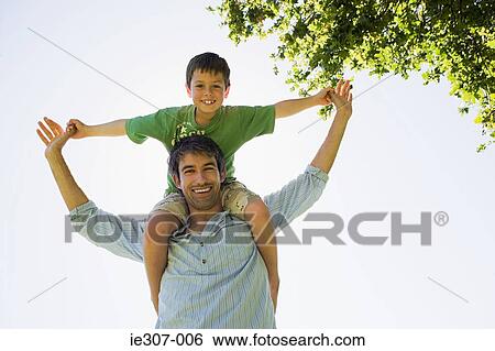 Portrait of a father and son View Large Photo Image Stock Photograph - Portrait of a father and son. Fotosearch
