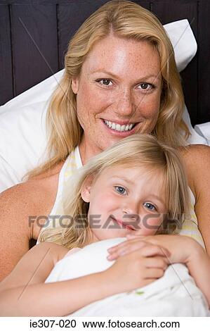 Stock Image - Portrait of a mother and daughter. Fotosearch