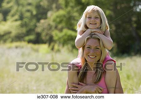 Portrait of a mother and daughter View Large Photo Image Stock Photo - Portrait of a mother and daughter. Fotosearch