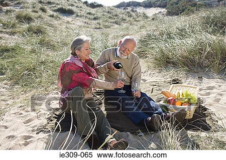 Senior couple having a picnic View Large Photo Image Stock Photography - Senior couple having a picnic. Fotosearch