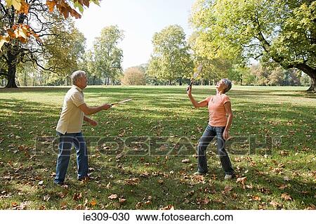 Senior couple playing badminton View Large Photo Image Stock Image - Senior couple playing badminton. Fotosearch