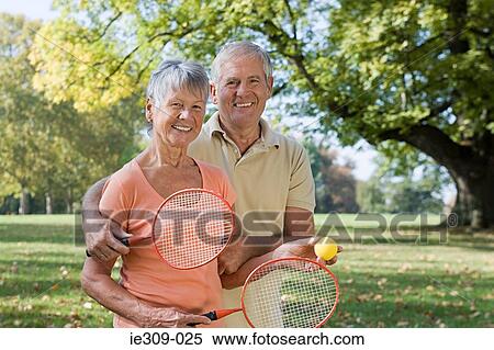 Senior couple playing badminton View Large Photo Image Stock Photography - Senior couple playing badminton. Fotosearch