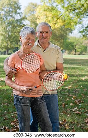 Senior couple playing badminton View Large Photo Image Stock Photography - Senior couple playing badminton. Fotosearch