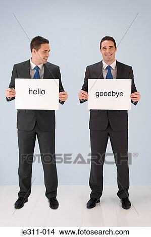 Businessmen holding signs View Large Photo Image Picture - Businessmen holding signs. Fotosearch