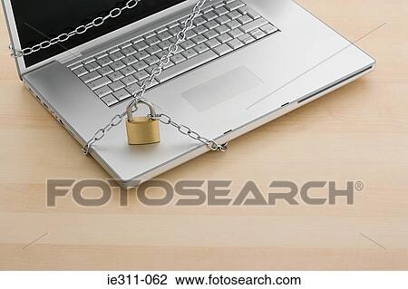 Chain and lock on laptop View Large Photo Image Stock Image - Chain and lock on laptop. Fotosearch