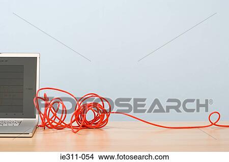 Laptop and cable View Large Photo Image Picture - Laptop and cable. Fotosearch