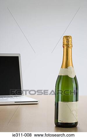 Laptop and champagne View Large Photo Image Stock Photo - Laptop and champagne. Fotosearch
