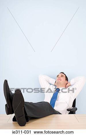 Office worker taking a break View Large Photo Image Stock Image - Office worker taking a break. Fotosearch