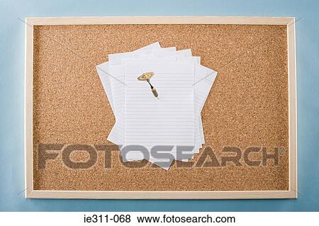 Paper and darts on a noticeboard View Large Photo Image Stock Photo - Paper and darts on a noticeboard. Fotosearch
