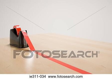 Red tape on desk View Large Photo Image Picture - Red tape on desk. Fotosearch