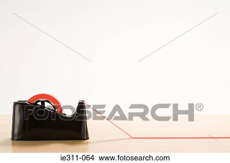 Red tape on desk View Large Photo Image Picture - Red tape on desk. Fotosearch