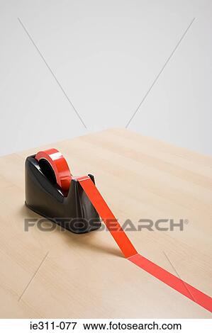 Stock Photo - Red tape on desk. Fotosearch