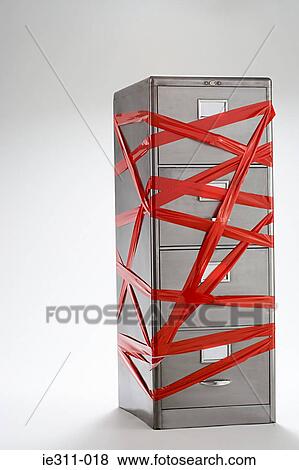 Red tape over filing cabinet View Large Photo Image Stock Photo - Red tape over filing cabinet. Fotosearch