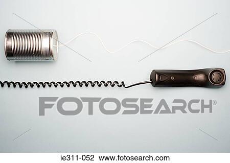 Stock Image - Telephone and tin can telephone. Fotosearch