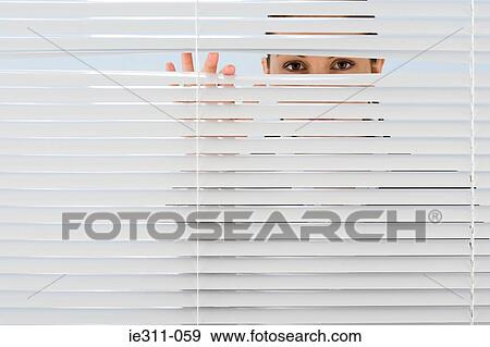 Woman looking though blinds View Large Photo Image Stock Photo - Woman looking though blinds. Fotosearch