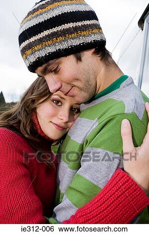 A couple hugging View Large Photo Image Stock Photograph - A couple hugging. Fotosearch