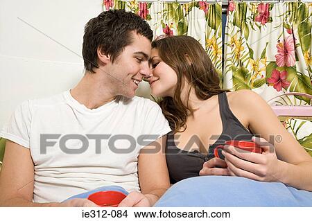 A teenage couple about to kiss View Large Photo Image Picture - A teenage couple about to kiss. Fotosearch