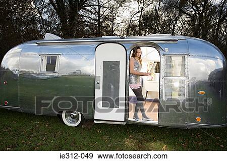 Stock Photo - A teenage girl using a laptop. Fotosearch