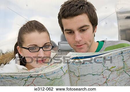 Teenage couple with a map View Large Photo Image Stock Image - Teenage couple with a map. Fotosearch