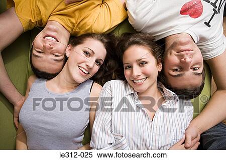 Stock Photography - Teenage friends having a sleepover. Fotosearch