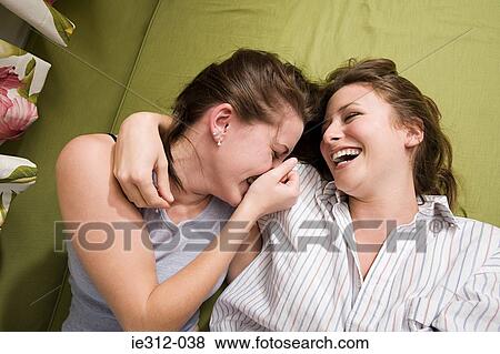 Stock Photo - Two teenage girls laughing. Fotosearch