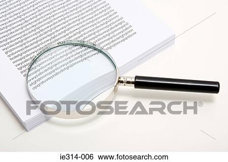 Magnifying glass and a stack of paper View Large Photo Image Stock Photograph - Magnifying glass and a stack of paper. Fotosearch
