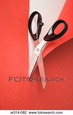 Scissors cutting red paper View Large Photo Image Stock Image - Scissors cutting red paper. Fotosearch