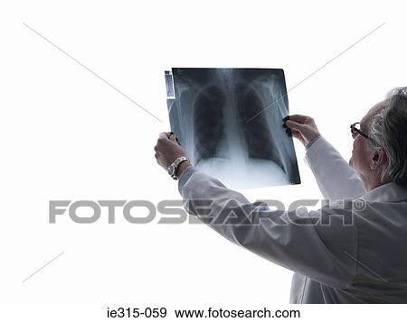Stock Photo - Doctor looking at an x-ray. Fotosearch