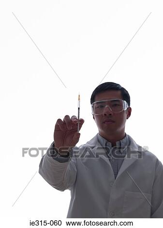 Stock Image - Doctor with syringe. Fotosearch