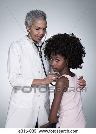Stock Image - Girl and doctor. Fotosearch