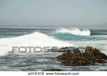 Waves hitting rocks View Large Photo Image Stock Photo - Waves hitting rocks. Fotosearch
