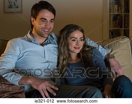 A couple watching tv View Large Photo Image Stock Image - A couple watching tv. Fotosearch