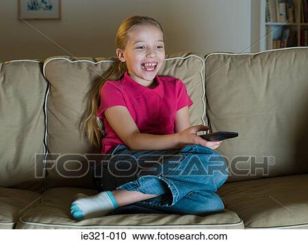 A girl watching tv View Large Photo Image Stock Image - A girl watching tv. Fotosearch