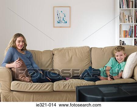 A mother and son watching tv View Large Photo Image Picture - A mother and son watching tv. Fotosearch