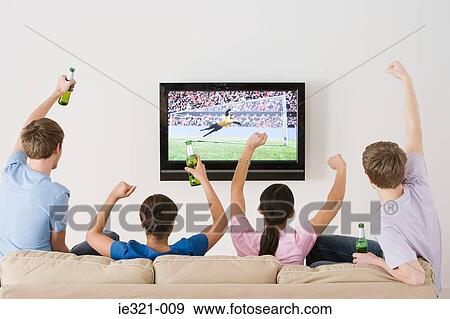 Friends watching football on the tv View Large Photo Image Stock Photo - Friends watching football on the tv. Fotosearch