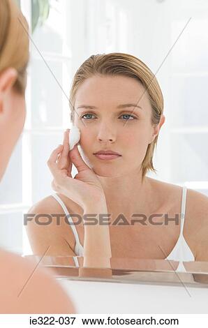 A woman applying make up View Large Photo Image Stock Photo - A woman applying make up. Fotosearch