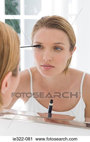 A woman applying mascara View Large Photo Image Stock Image - A woman applying mascara. Fotosearch