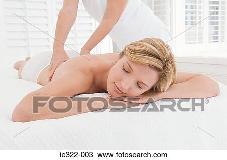 A woman having a massage View Large Photo Image Stock Image - A woman having a massage. Fotosearch