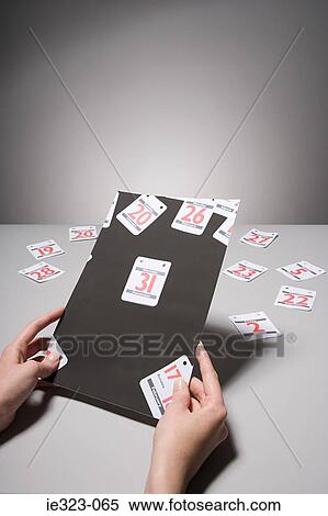 A person holding calendar dates View Large Photo Image Stock Photography - A person holding calendar dates. Fotosearch