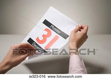 A woman holding a calendar date View Large Photo Image Stock Photograph - A woman holding a calendar date. Fotosearch