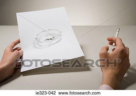A woman holding a photograph of an ashtray and a cigarette View Large Photo Image Stock Image - A woman holding a photograph of an ashtray and a cigarette. Fotosearch