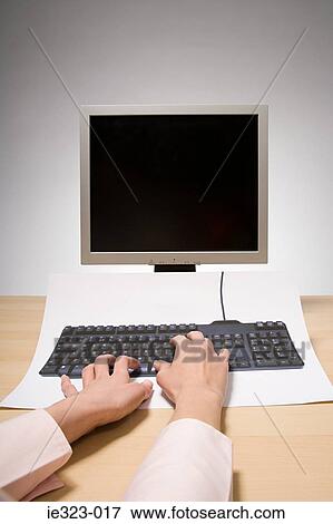A woman typing on a computer View Large Photo Image Stock Photo - A woman typing on a computer. Fotosearch