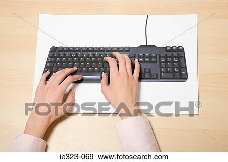 A woman typing View Large Photo Image Stock Photo - A woman typing. Fotosearch
