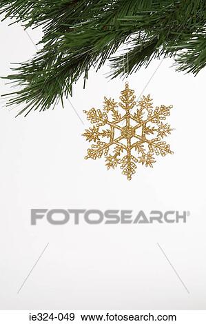 A christmas decoration hanging on a tree View Large Photo Image Stock Photo - A christmas decoration hanging on a tree. Fotosearch