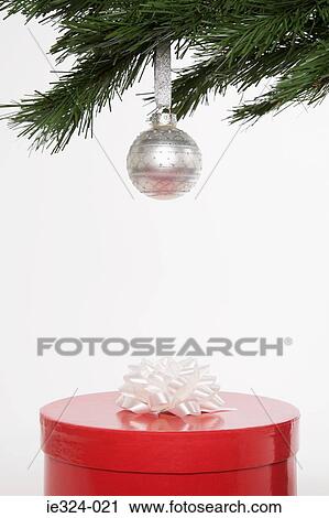 A christmas present under a christmas tree View Large Photo Image Stock Image - A christmas present under a christmas tree. Fotosearch
