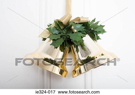 Christmas bells hanging on a door View Large Photo Image Stock Photo - Christmas bells hanging on a door. Fotosearch