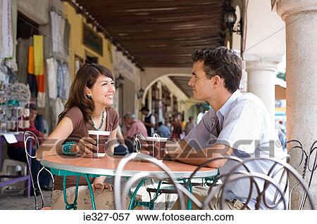 Couple having coffee View Large Photo Image Stock Photo - Couple having coffee. Fotosearch