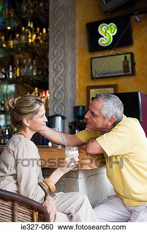 Couple in a bar View Large Photo Image Stock Image - Couple in a bar. Fotosearch